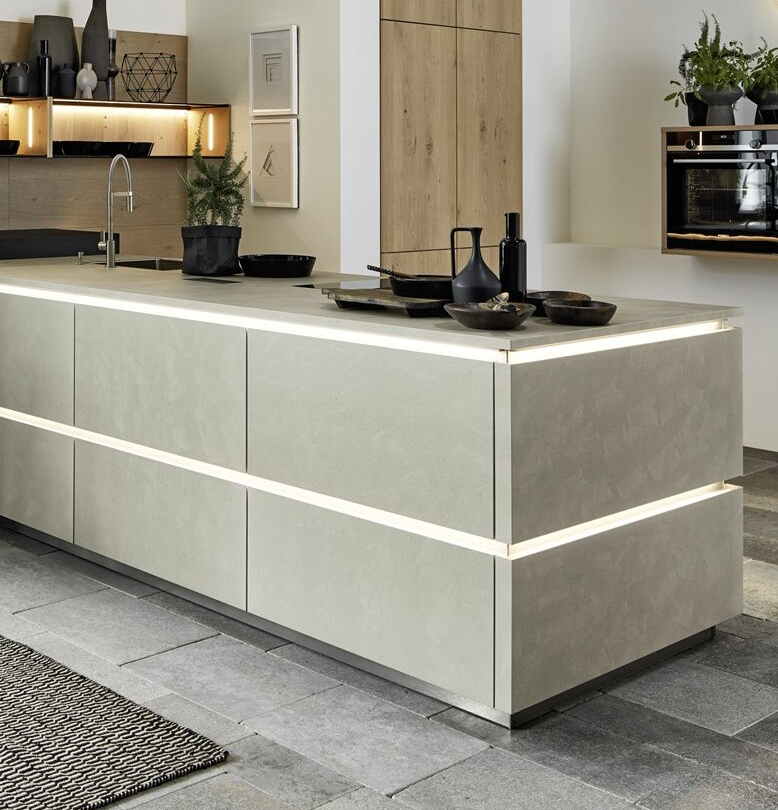 Horizontal true handleless profile with integrated LED lighting running along base units