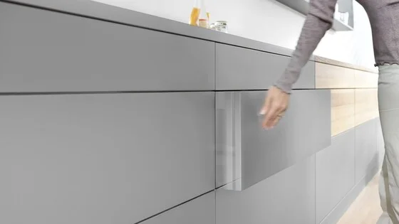 Push-to-open drawer mechanism showing the runner system with integrated touch-open and soft-close function