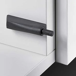 Push-to-open mechanism fitted to the side panel of the carcass showing mounting position and adjustment points