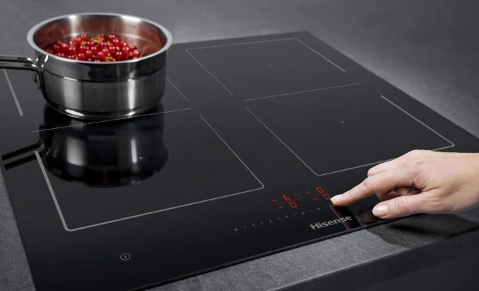 Induction hob showing flat glass surface with zone indicators and no visible heating elements