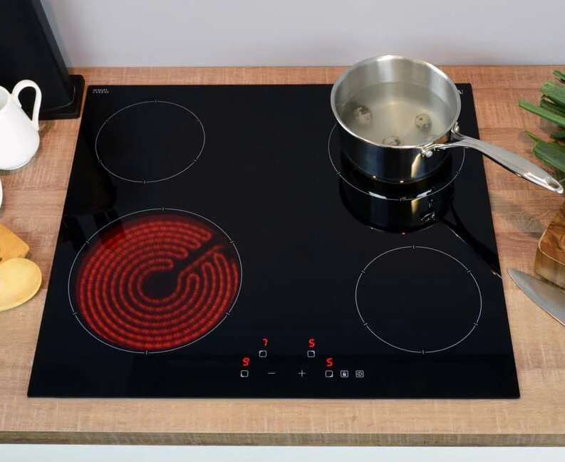 Ceramic hob showing smooth black glass surface with radiant heating zones and touch controls