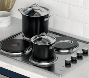 Hot plate electric hob showing solid sealed plate heating elements in a standard four-plate configuration