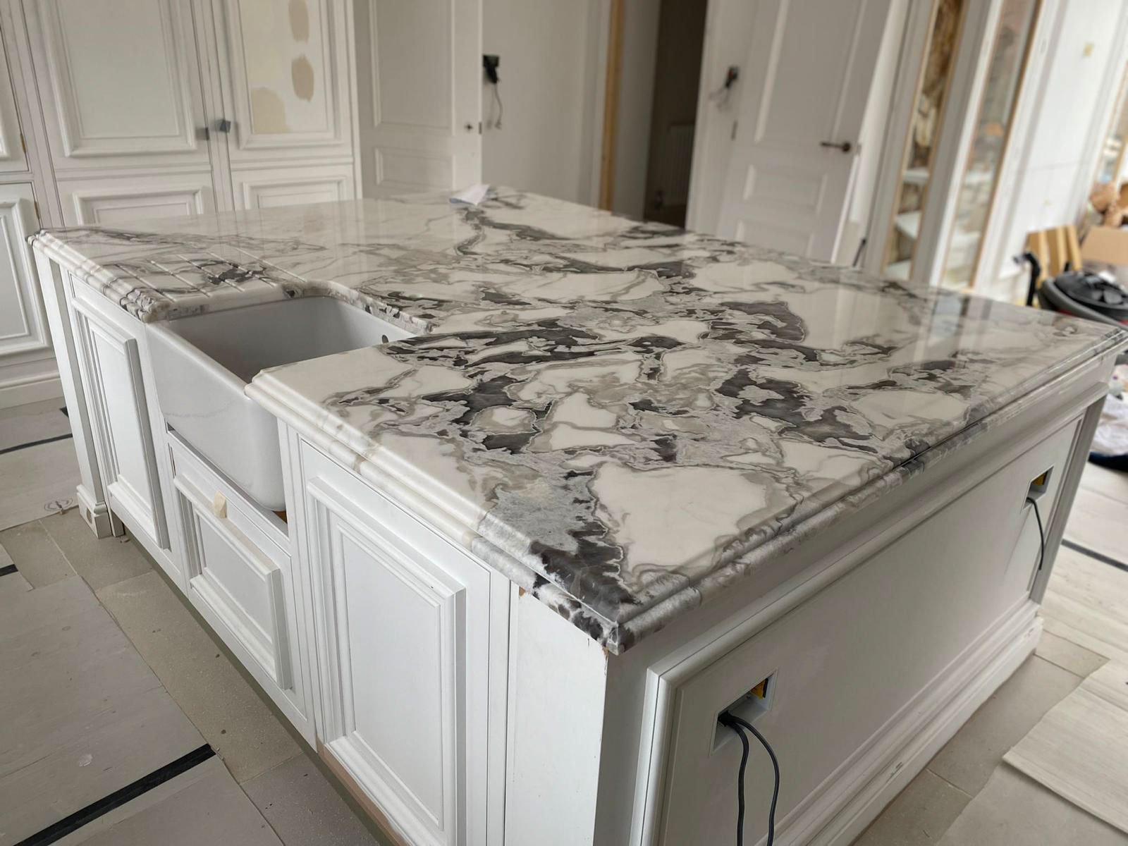Quartzite worktop in a contemporary kitchen showing the dramatic natural veining pattern and crystalline surface texture characteristic of premium metamorphic quartzite stone