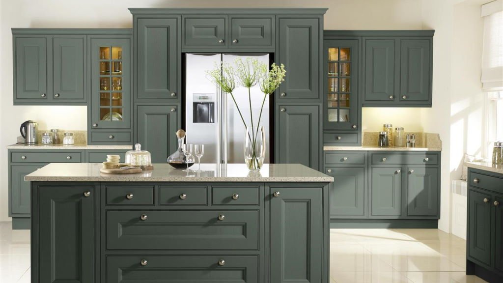 In-frame German kitchen showing traditional knob handles proportioned to the smaller door areas within the face frame