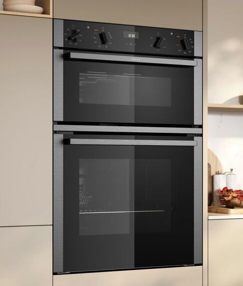 Neff double oven showing the two-cavity built-in format with a smaller top cavity for grilling and a larger main cavity below