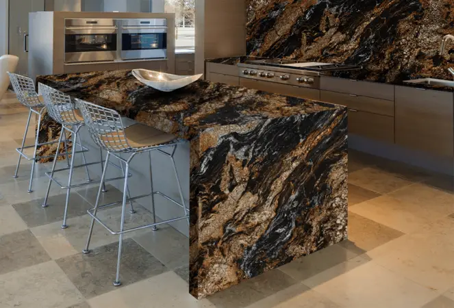 Granite worktop in a contemporary kitchen showing the natural mineral grain pattern and polished surface finish with visible quartz and feldspar crystals in the stone