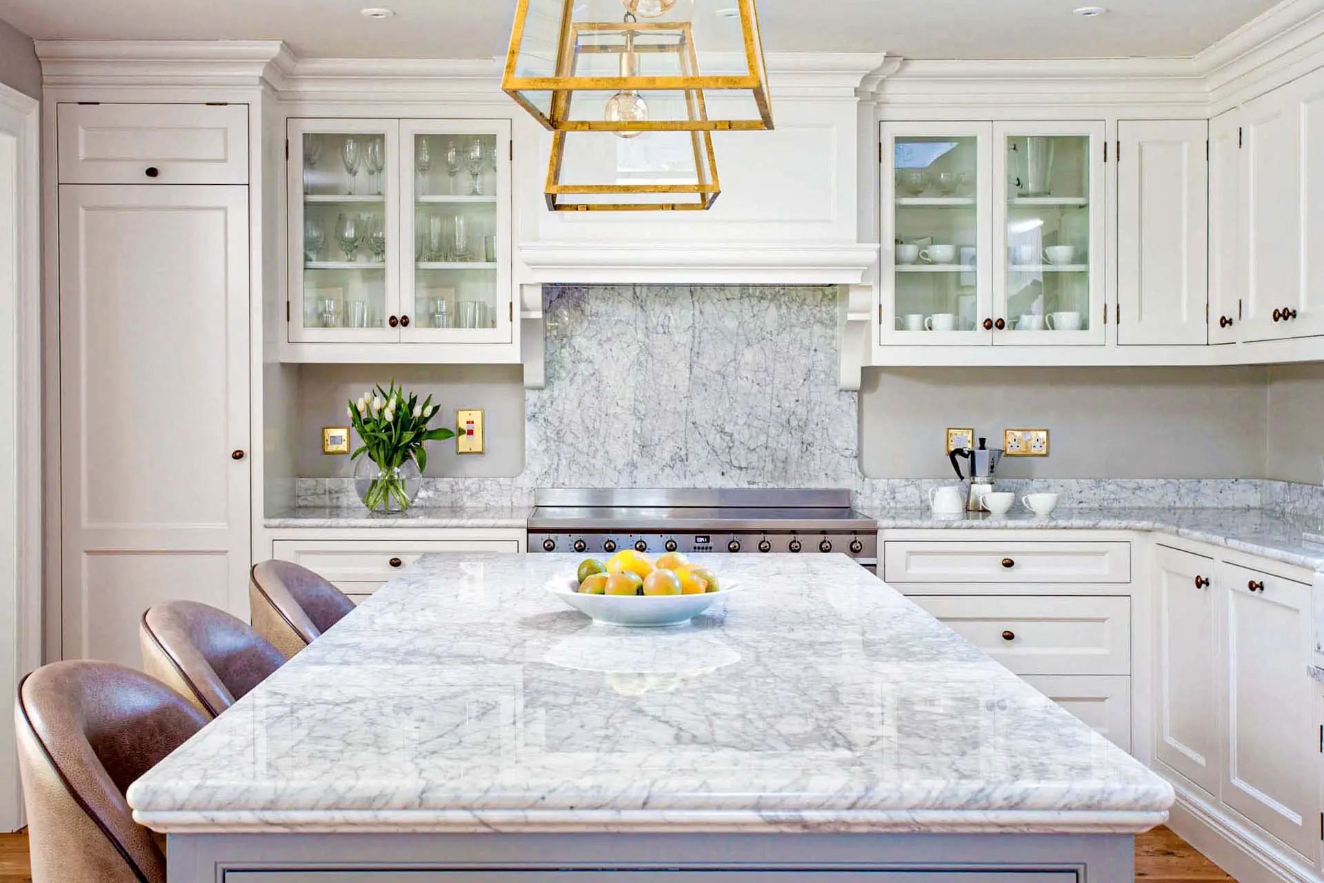 Marble worktop in a contemporary kitchen showing the natural veining, cool white surface, and dramatic pattern characteristic of premium Italian marble installed on a kitchen island