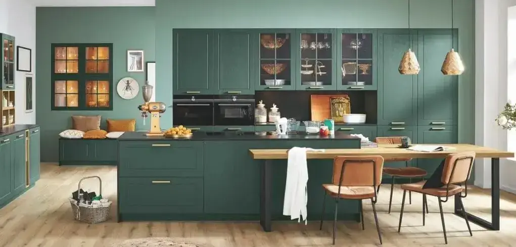 Ballerina green Shaker kitchen showing classic framed door with recessed centre panel in a contemporary open-plan layout