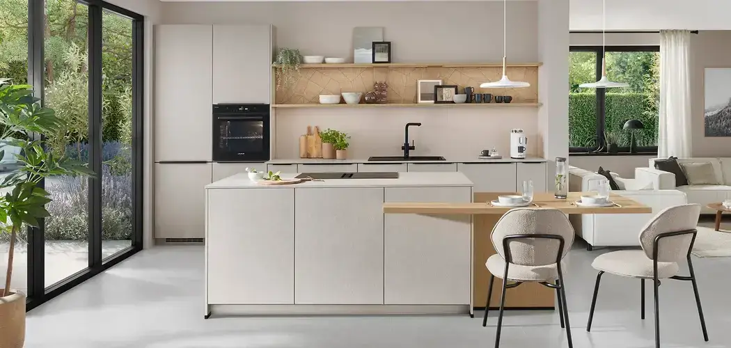 Island kitchen layout diagram showing the island position, clearance dimensions, and circulation routes around all four sides