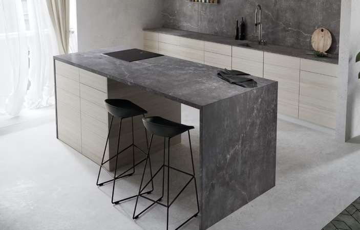 Porcelain worktop with dark concrete effect pattern showing the smooth matte surface and industrial aesthetic available in contemporary porcelain ranges