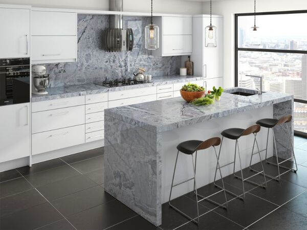 Granite kitchen showing the book matched stone pattern across a kitchen island with the mirrored veining visible at the centre join of the two consecutive slab faces