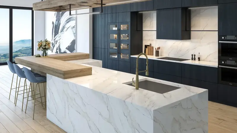 Book matched quartz worktop on a large kitchen island showing the mirrored veining pattern creating a symmetrical effect across the central join with the bold marble-style veining reflected from the centre outward