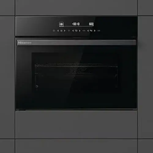 450mm high built-in combination microwave in a kitchen tall housing showing the compact combi microwave format at approximately 45cm in niche height with oven-style controls and a larger internal cavity than the 380mm standard microwave