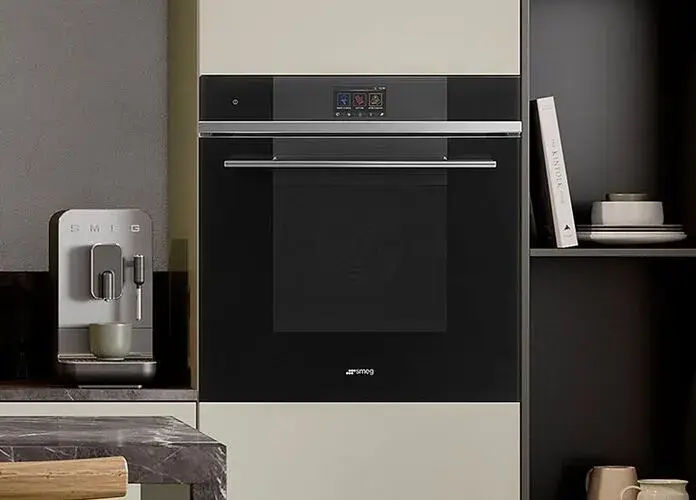 600mm wide built-in combination microwave in a tall housing unit showing the full-width 600mm appliance front panel design and the fitted appearance of a combination microwave in a contemporary built-in kitchen installation