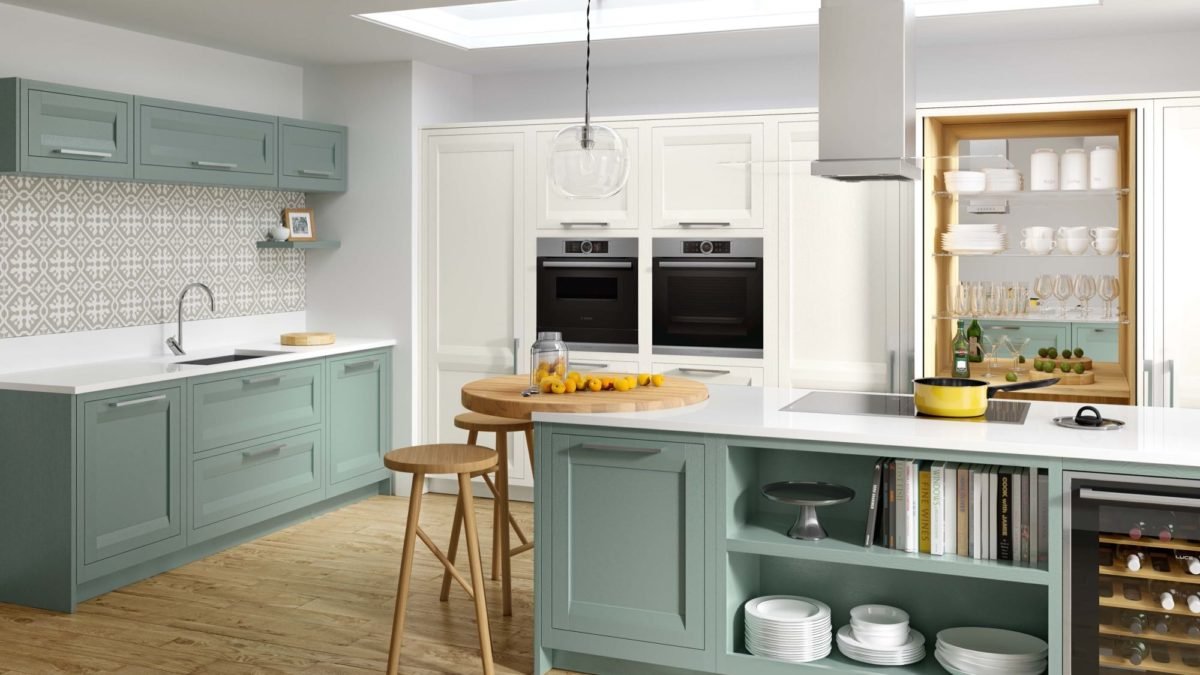 Caledonia in-frame kitchen showing the full layout with balanced unit widths and consistent frame reveals in an open-plan space
