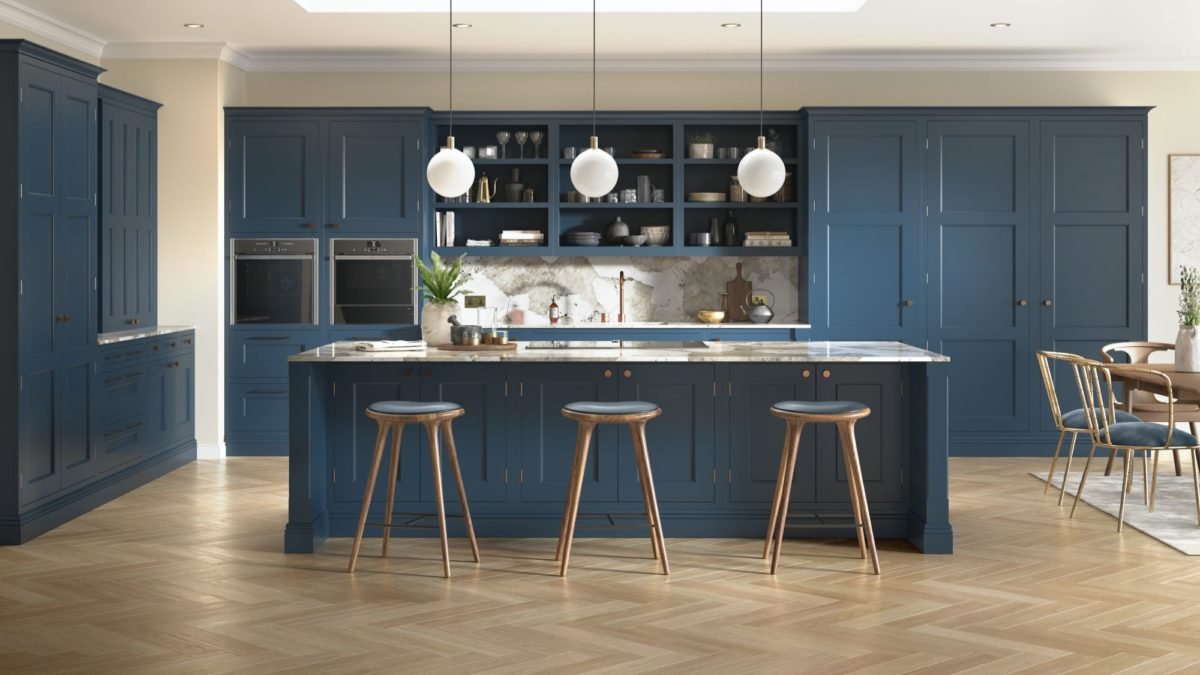 Caledonia in-frame kitchen island showing framed panel sides and furniture skirting completing the island as a freestanding piece