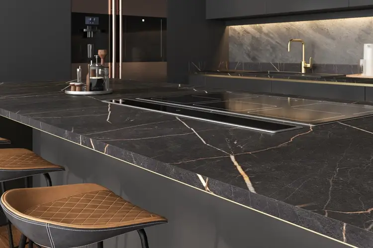 HPL worktop in a contemporary German kitchen showing the clean edge profile and realistic surface pattern of a high-pressure laminate worktop coordinated with the kitchen door finish and cabinetry colour