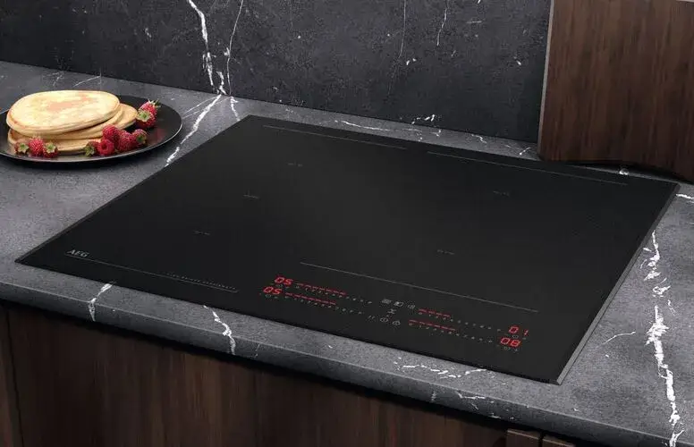 Matt finish induction hob showing the newer low-sheen glass-ceramic surface with a refined, quiet visual quality