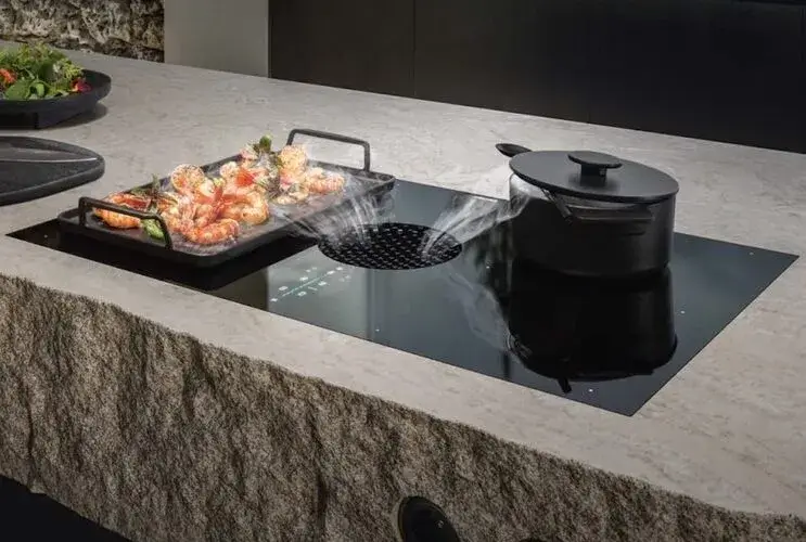 Matt finish vented hob showing the low-sheen glass surface with a refined, quiet visual quality that integrates into the worktop without reflecting the room