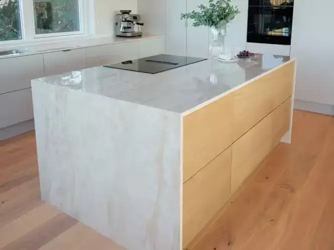 Ceramic worktop in a contemporary kitchen showing the large format slab surface with a realistic marble-effect pattern and the clean minimal edge profile typical of ceramic worktop installations in modern UK kitchens