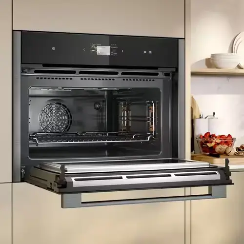 Combination microwave with flatbed design showing the completely flat cavity floor without a turntable plate demonstrating the full usable floor area and easier cleaning that flatbed microwave design provides compared to turntable models