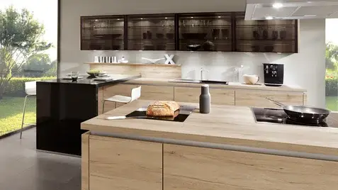 Close-up of a German laminate worktop surface showing the texture and pattern quality of a premium laminate worktop finish with realistic stone effect patterning and the clean front edge detail of a post-formed or square edge profile