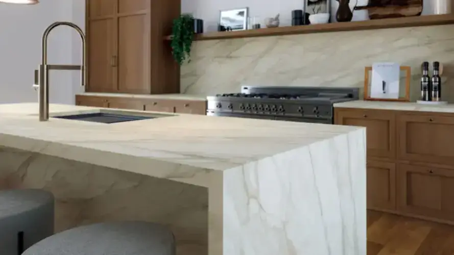 Porcelain worktop built-up edge detail showing the laminated strip bonded to the underside of the front face of a 12mm slab creating the visual appearance of a thicker worktop