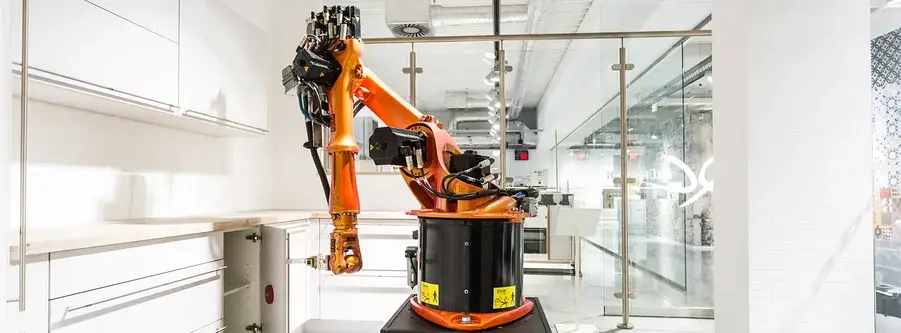 Robotic test arm in German kitchen manufacturer QM lab performing door cycle test