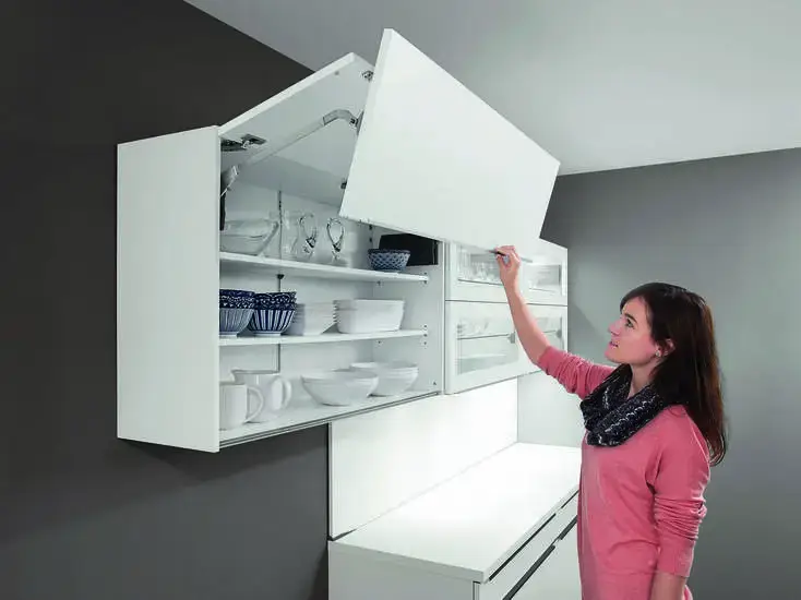 Inside of a German kitchen wall unit showing 340–350mm depth, shelf supports, and internal finish